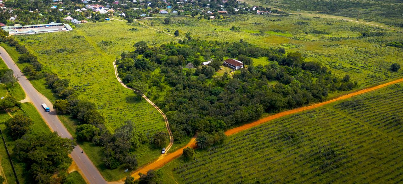 Aerial view of the Amboni Industrial Park site, green fields and the access road